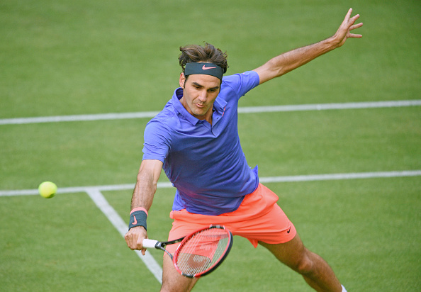 Roger Federer hits a volley at the 2015 Gerry Weber Open in Halle/Getty Images