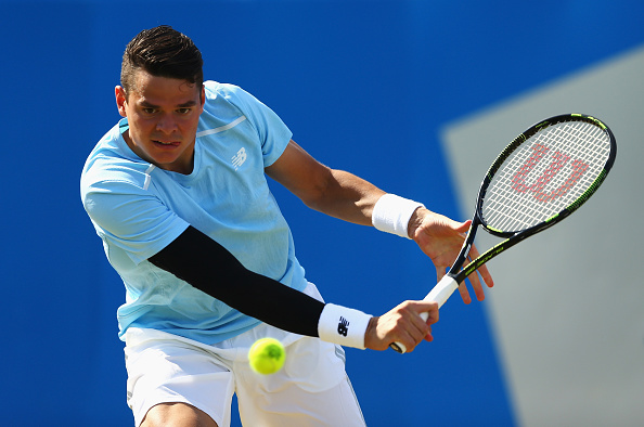 Milos Raonic lays a backhand shot (Photo: Clive Brunskill/Getty Images)