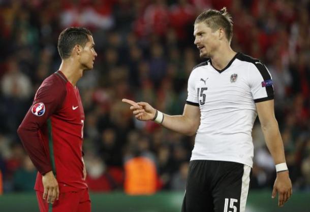 The defender talking to Cristiano Ronaldo at Euro 2016 (Photo: Getty Images)