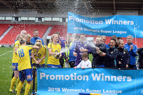 Doncaster players celebrate their promotion back to WSL1 (Photo credit: Nigel Roddis/Getty)