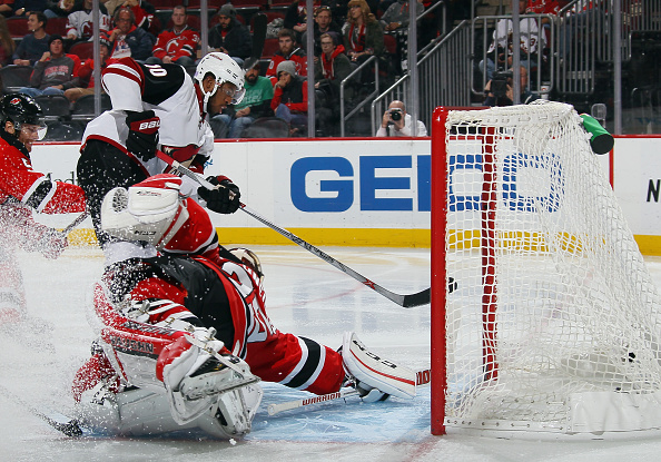 Anthony Duclair #10 of the Arizona Coyotes scores at powerplay goal at 47 seconds of the third period against Cory Schneider #35 of the New Jersey Devils at the Prudential Center on October 20, 2015 in Newark, New Jersey. The Devils defeated the Coyotes 3-2 in overtime. (Photo by Bruce Bennett/Getty Images)