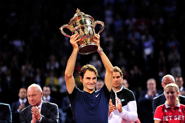 Roger Federer lifts his seventh Swiss Indoors trophy/Getty Images