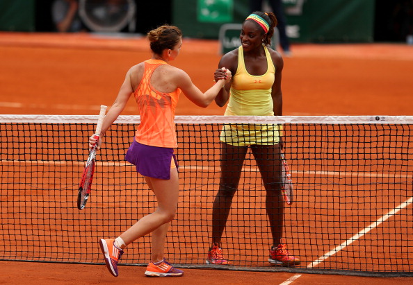 Stephens and Halep embrace each other at the net after their round of 16 match at the 2014 French Open. Photo credit : Clive Brunskill