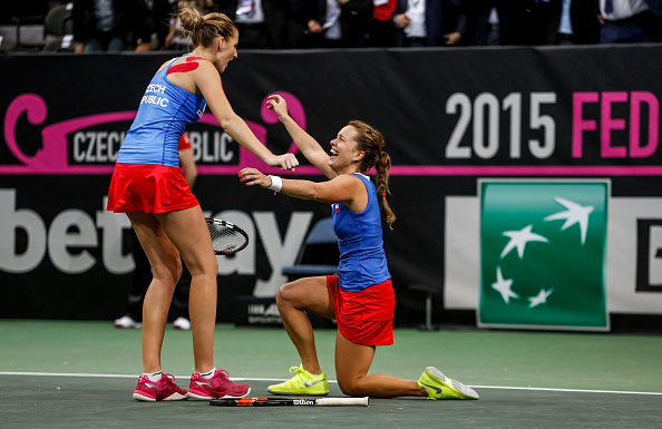 Strycova (right) and Pliskova celebrate after converting a match point to give Czech Republic the Fed Cup title last year. Photo credit: Matej Divizna/Getty Images.