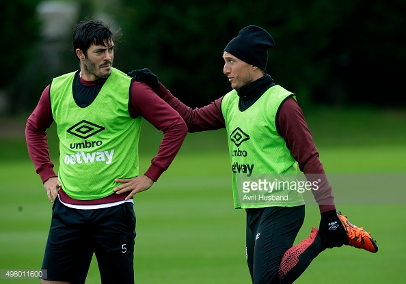 Above: Mark Noble with Crystal Palace's James Tomkins during his time at West Ham United 