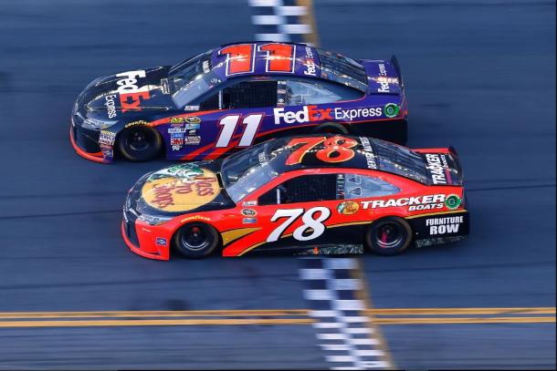 Denny Hamlin takes the checkered flag in a photo finish last year. (Jonathan Ferrey/Getty Images)