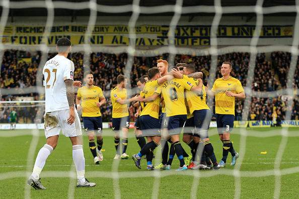 Kyle Bartley watches as Oxford United celebrate in their 3-2 win over Swansea. That has been the defender's only first team action of 2016. (Marc Atkins/Mark Leech Sports Photography/Getty Images)