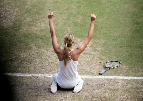Maria Sharapova celebrates after winning her first Grand Slam at Wimbledon in 2004. (Photo by Phil Cole/Getty Images)