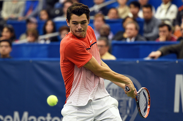 Taylor Fritz of the United States returns a shot to Kei Nishikori of Japan during their singles final match at Memphis Open (Photo:Stacey Revere/Getty Images)
