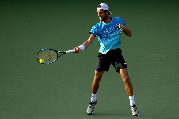 Joao Sousa returns a shot to Novak Djokovic during the Miami Open (Photo:Matthew Stockman/Getty Images)