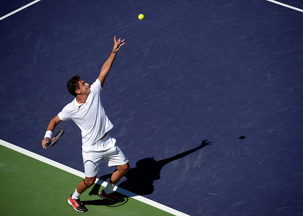 Nicolas Almagro serves against Inigo Cervantes during the BNP Paribas Open (Photo:Kevork Djansezian/Getty Images)