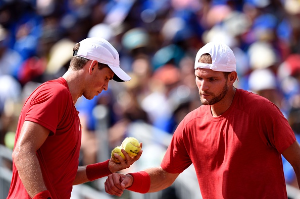 Vasek Pospisil and Philip Bester speak during their first round loss in the Davis Cup (Photo:Miguel Medina/Getty Images)