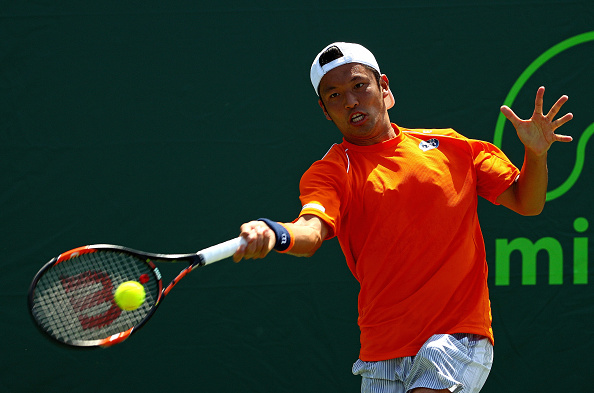 Tatsuma Ito returns a shot to Gael Monfils in his match at the Miami Open (Photo:Mike Ehrmann/Getty Images)