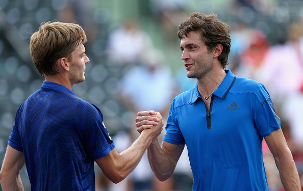 David Goffin shakes hands at the net after his three set victory against Gilles Simon in their quarter final match during the Miami Open (Photo:Clive Brunskill/Getty Images)