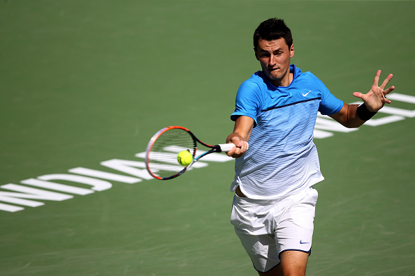 Bernard Tomic hits a forehand at the BNP Paribas Open in Indian Wells/Getty Images