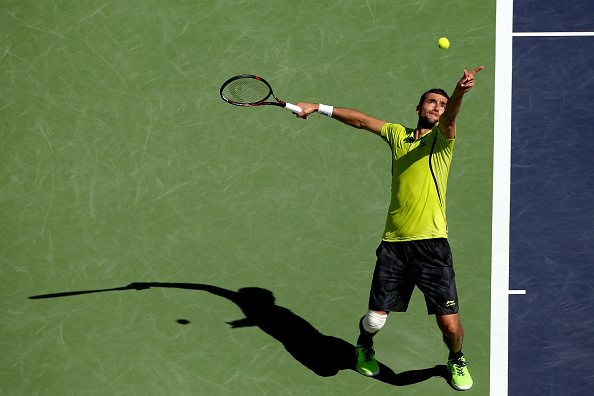 Cilic serves against David Goffin at the 2016 BNP Paribas Open. Credit: Matthew Stockman/Getty Images