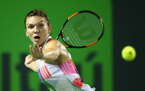 simona Halep of Romania plays a forehand against Daria Kasatkina of Russia in their second round match during the Miami Open. | Photo: Getty Images Sport, Clive Brunskill