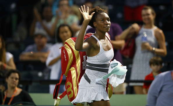 Venus Williams walks off the court after an opening match loss at the Miami Open/Getty Images