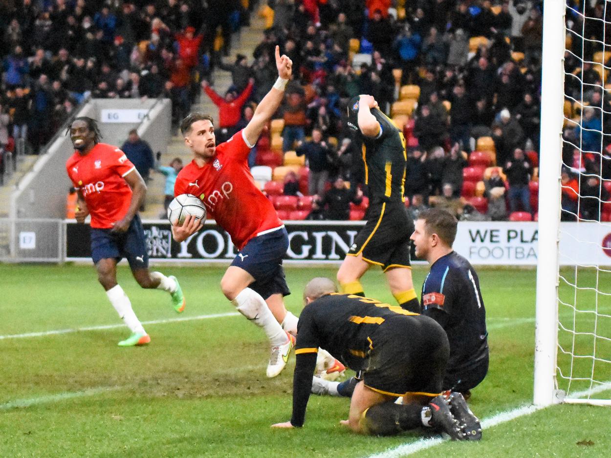 Mitch Hancox pulls a goal back for York City against Morpeth Town (Credit: Tom Poole)