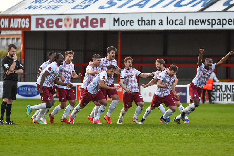 York City players celebrate an astonishing penalty shoot-out win against Dagenham (Photo: Tom Poole)