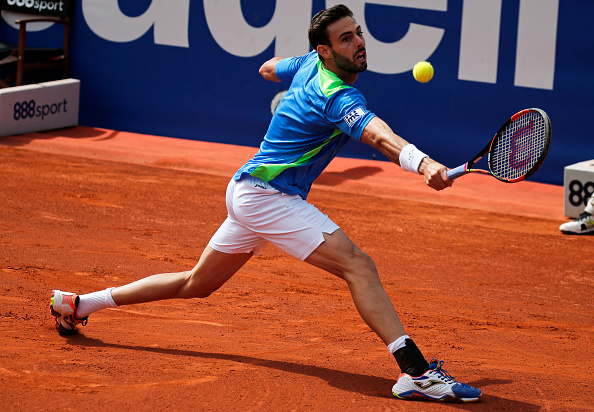 Marcel Granollers slides into a backhand at the Barcelona Open Banc Sabadell/Getty Images