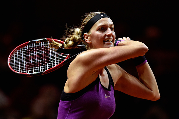 Kvitova returns a backhand to Monica Niculescu in their second round match. Photo credit: Dennis Grombkowski/Getty Images.