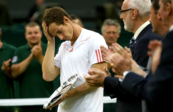  Andy Murray looks down after his defeat against Roger Federer at Wimbledon 2012. (Photo by AMA/Corbis via Getty Images)