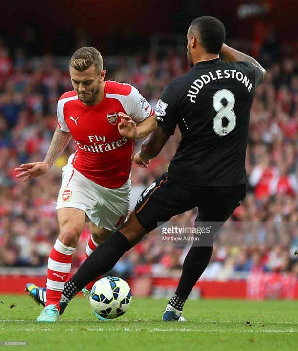 Wilshere against Huddlestone will be a key contest (photo: Getty Images)