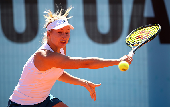 Gavrilova reaches for a backhand in her opening match. Photo credit: Clive Brunskill/Getty Images.