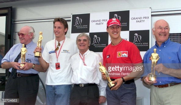 A young Button with the iconic Schumacher. Photo: Getty