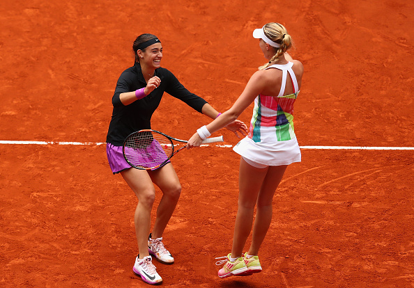 Garcia and Mladenovic celebrate after winning | Photo: Julian Finney/Getty Images