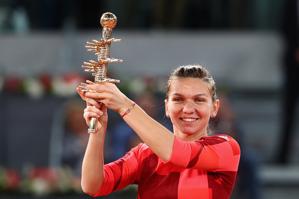 Simona Halep hoists the Mutua Madrid Open trophy after her win over Dominika Cibulkova in the final/Getty Images