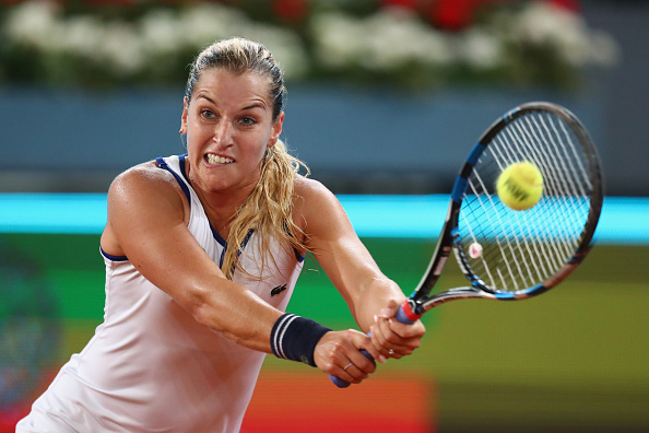 Dominika Cibulkova hits a backhand at the Mutua Madrid Open/Getty Images