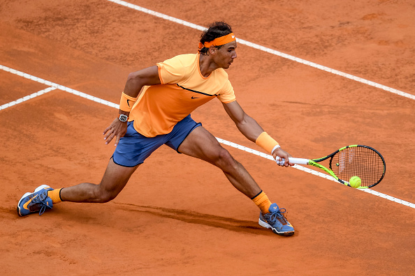 Rafael Nadal slides into a shot at the Internazionali BNL d'Italia in Rome/Getty Images