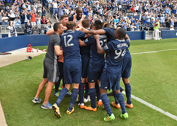 Sporting KC celebrating Jacob Peterson's game winning goal (Photo: Peter G. Aiken / Getty Images)
