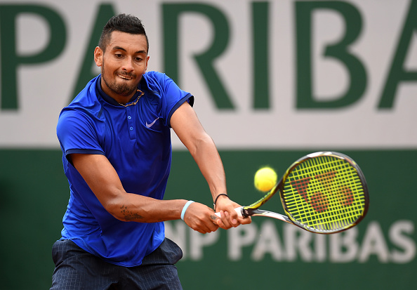 Kyrgios slams a backhand down the line, barely clipping the line for a winner. Credit: Dennis Grombkowski/Getty Images