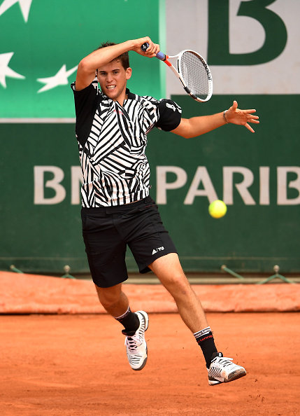 Dominic Thiem of Austria hits a forehand during the Men's Singles second round match against Guillermo Garcia-Lopez. (Photo by Clive Brunskill/Getty Images)