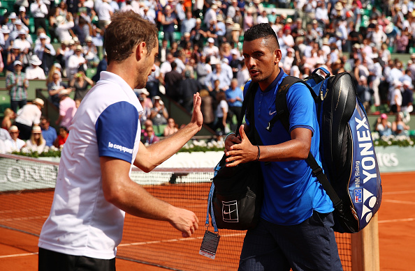 Richard Gasquet shakes hands with a dejected Nick Kyrgios (Photo: Clive Brunskill/Getty Images)