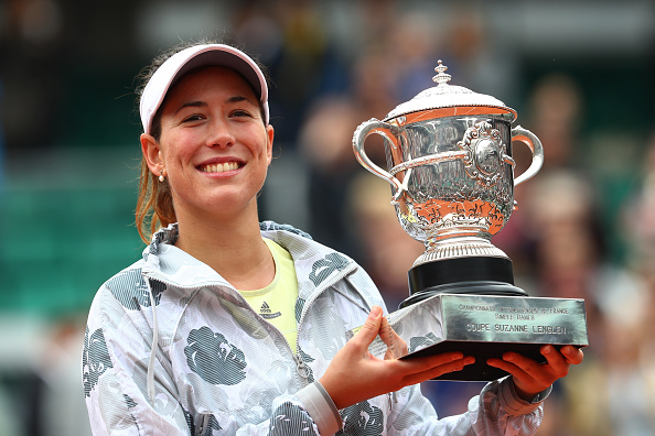 Muguruza poses with the trophy after the trophy presentation ceremony last weekend. Photo credit: Julian Finney/Getty Images.