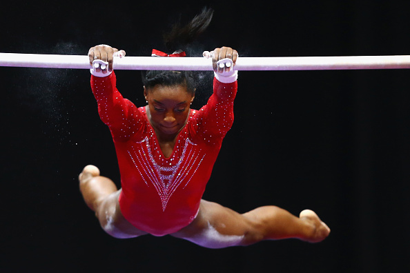 Simone Biles on the uneven bars at the Secret US Classic/Getty Images