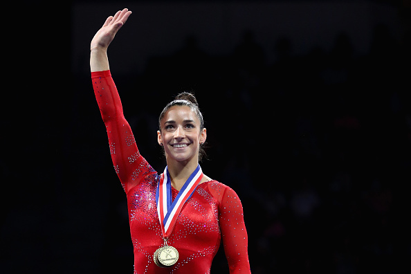 Aly Raisman waves to the crowd after winning the Secret US Classic in Hartford/Getty Images