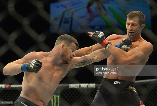 Bisping (L) defeated Luke Rockhold (R) to win the middleweight title at UFC 199 | Photo: Getty/JayneKamin-Oncea