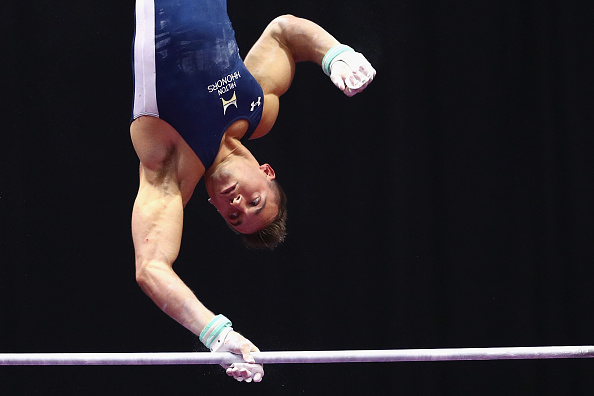 Sam Mikulak performs on the high bar at the P&G Men's Gymnastics Championships in Hartford/Getty Images