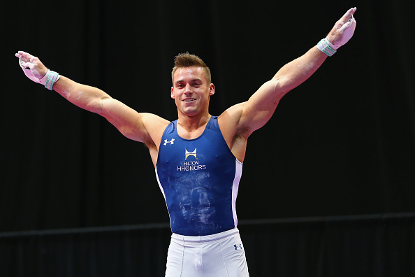 Sam Mikulak salutes after a routine at the P&G Men's Gymnastics Championships in Hartford/Getty Images