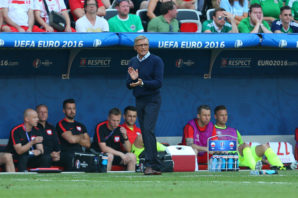 Adam Nawalka applauds his side's efforts from the dugout as they beat Northern Ireland 1-0. (Photo: Catherine Ivill - AMA/Getty Images)