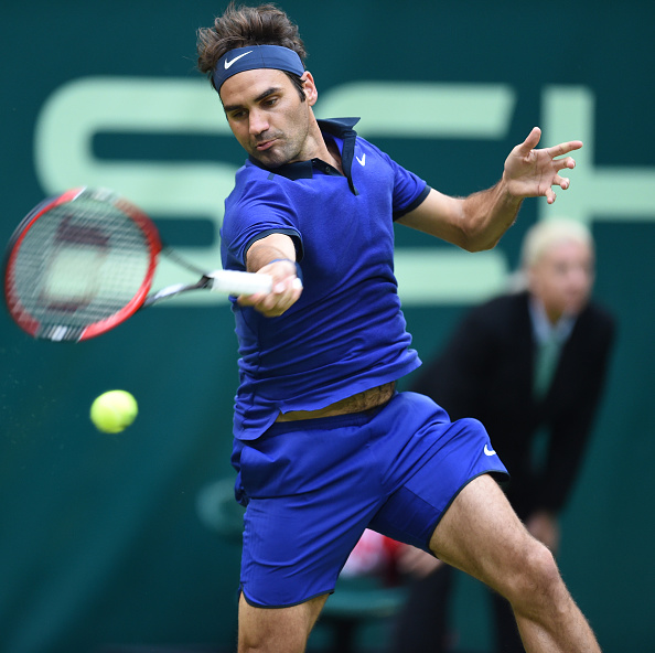 Federer smacks a forehand for a clean winner in his opening round victory in Halle. Credit: Carmen Jaspersen/Getty Images