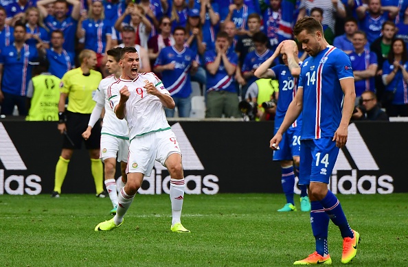 The contrast of emotion between the two sides at half time could not have been greater. (Photo: ATTILA KISBENEDEK/AFP/Getty Images)