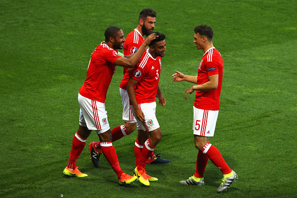 Neil Taylor is congratulated by Ashley Williams, as well as James Chester and Joe Ledley, as he scores against Russia. (Photo: Ian Walton/Getty Images)