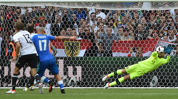 Mesut Özil watches on as his penalty is pushed away. (Photo: PHILIPPE HUGUEN/AFP/Getty Images)