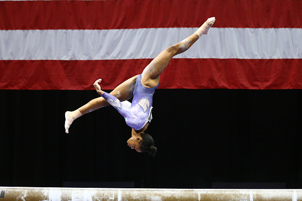 Gabby Douglas performs on the balance beam at the P&G Women's Gymnastics Championships in St. Louis/Getty Images